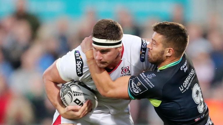 Robbie Diack is tackled by Ospreys scrum-half Rhys Webb